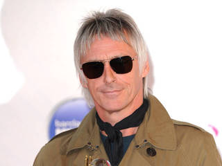 Paul Weller wins damages over family photos