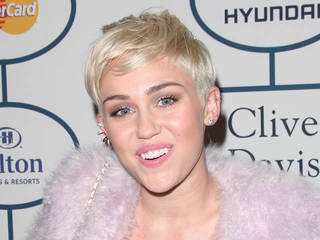 Miley Cyrus blasts unkind critics from sick bed