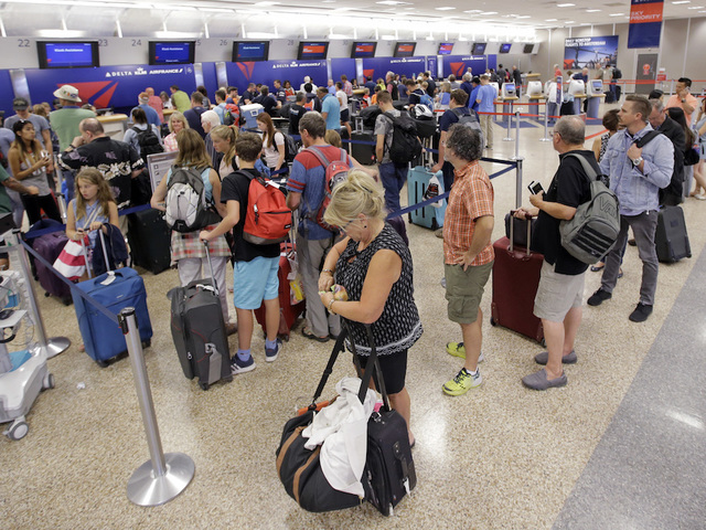 Delta cancels hundreds of Tuesday flights following Monday's mass outage