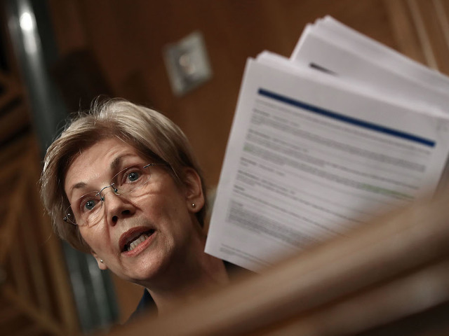 Warren knocks Obama, teases 2020 bid