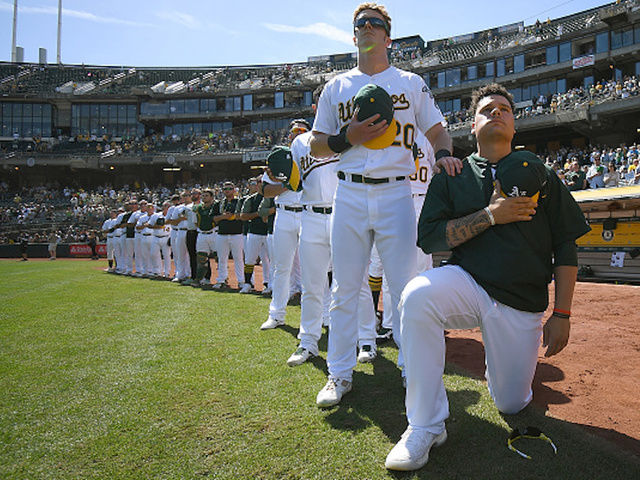 Baseball player who protested national anthem says he was denied service at restaurant