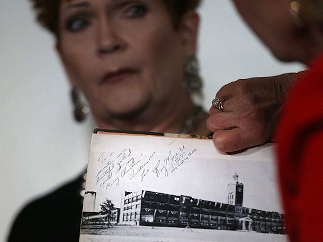 Roy Moore accuser acknowledges she added notes to yearbook signature