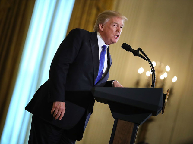 Trump lands in Davos, abroad again while Russia looms at home